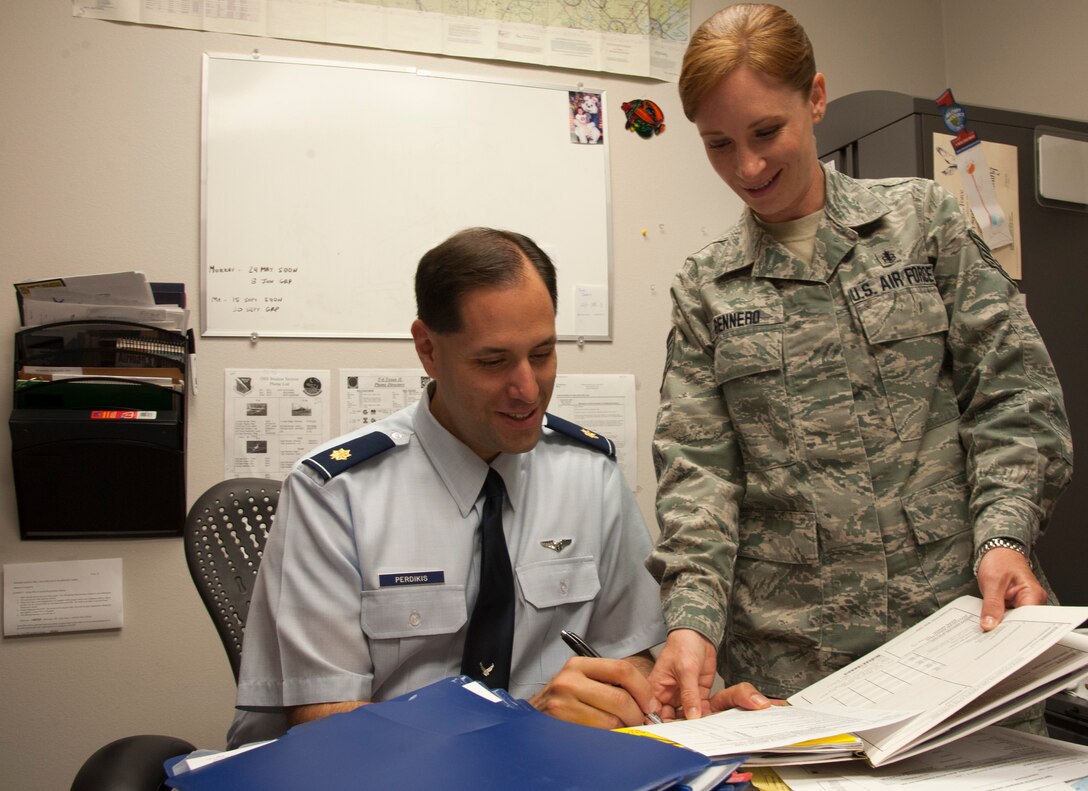 Maj. Serafim Perdikis, left, 47th Medical Operations Squadron chief of aerospace medicine, and Tech. Sgt. Jaimy Gennero, 47th MDOS chief of flight medicine, review patient documents at Laughlin Air Force Base, Texas, May 8, 2013. The American Nurses Association and Laughlin have declared the week of May 6 through 12 as National Nurses and Technicians Week to celebrate the safe, high quality care provided to patients. (U.S. Air Force photo/Airman 1st Class John D. Partlow)