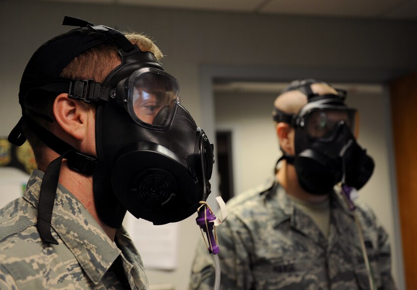 Barksdale Airmen perform a breathing exercise during a gas mask fit test on Barksdale Air Force Base, La., May 9, 2013. Barksdale personnel perform a number of breathing exercises to ensure they have the correct gas mask size and that there is no break in the seal. (U.S. Air Force photo/Airman 1st Class Benjamin Gonsier)