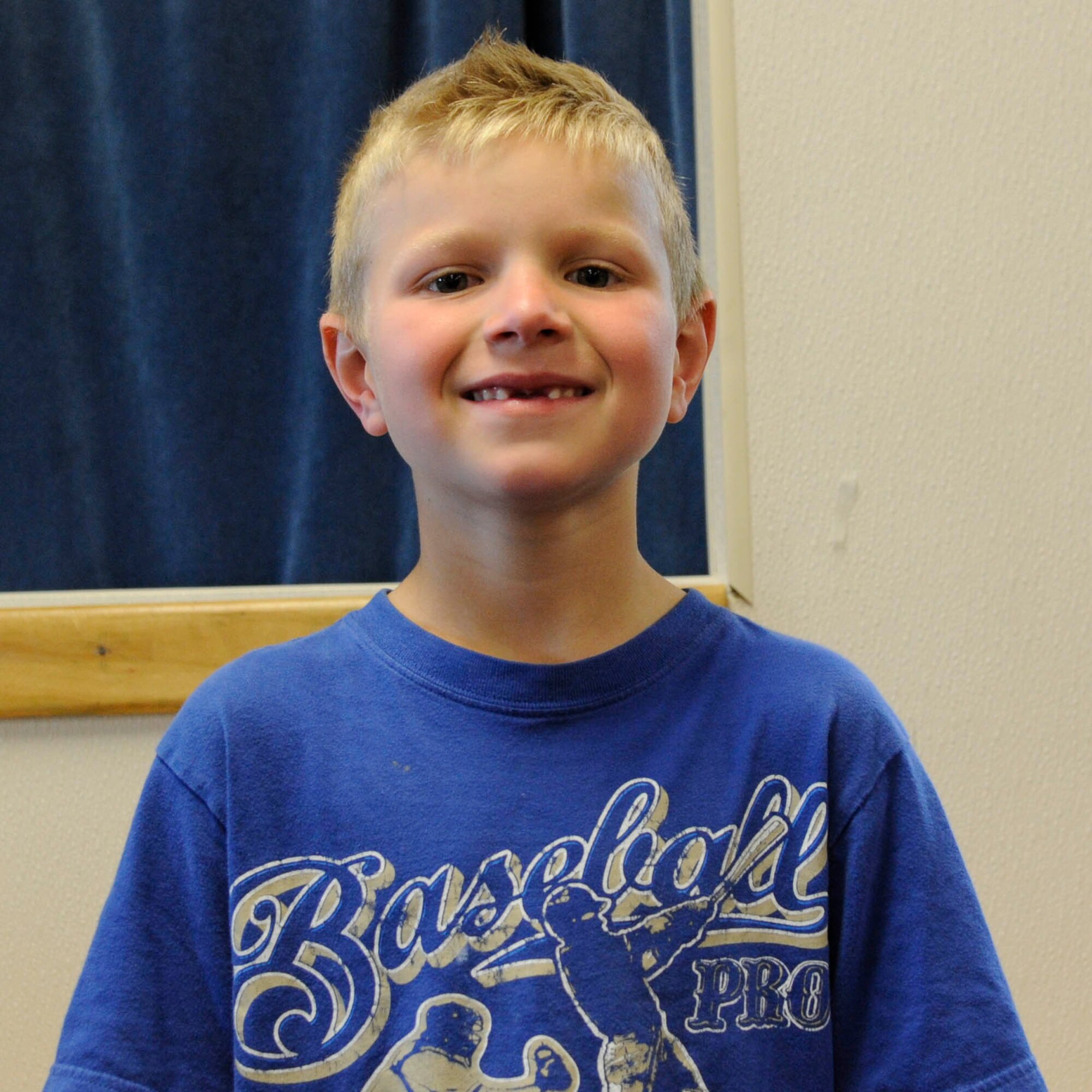 Zachary Polo, 7-year-old son of Navy Petty Officer 3rd Class Melanie Polo

“She helps people get in the Navy and does cool stuff. She helps defend our country.”