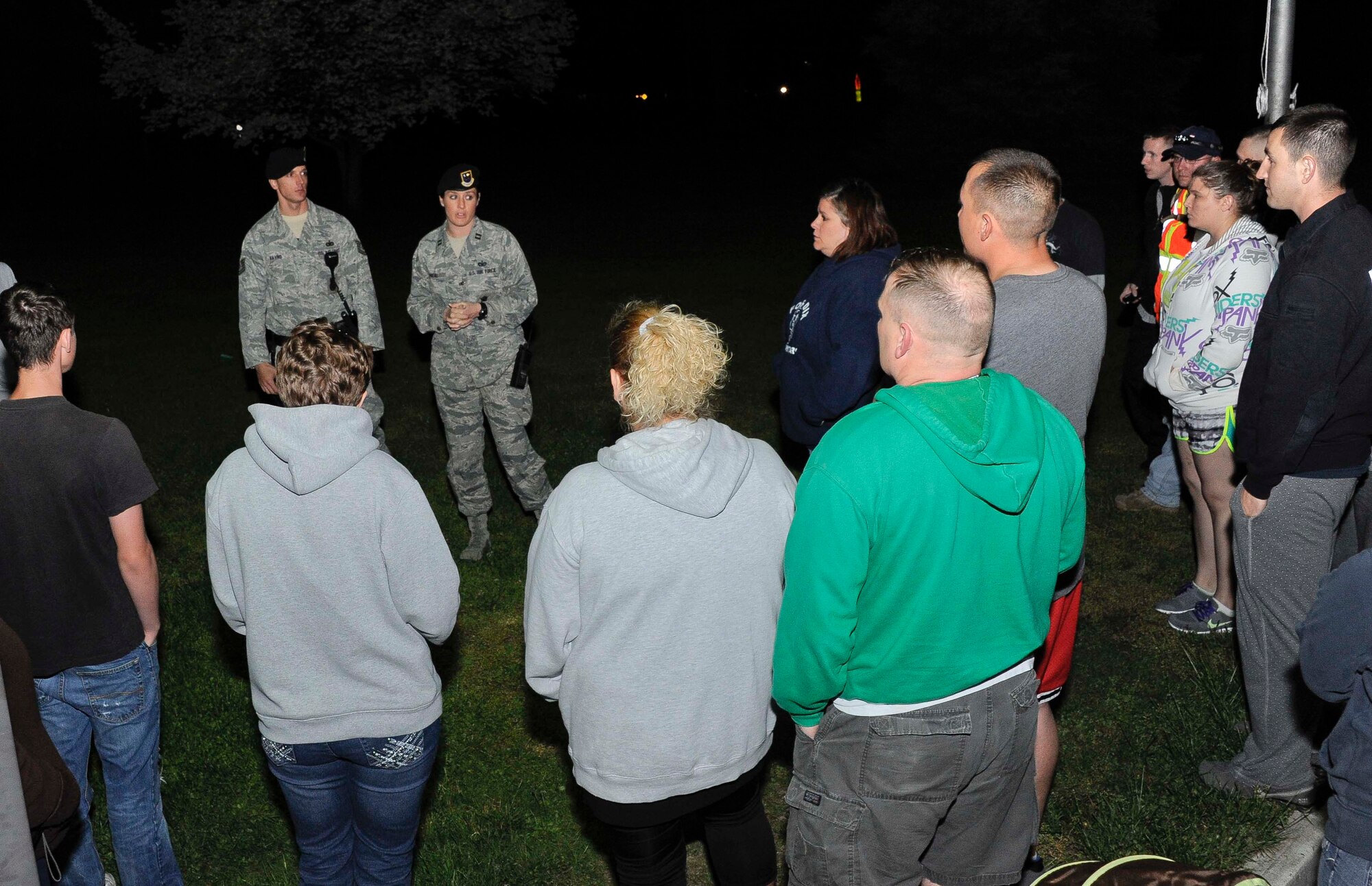 Capt. Shannon O'Neal, 87th Security Forces Squadron Operations officer in charge, organizes neighborhood watch volunteers after the disappearance of 13-year-old joint base military family member May 8, 2013, at Joint Base McGuire-Dix-Lakehurst, N.J. The teenager was reunited safely with her family after being found walking along Route 206 at approximately 11 a.m. May 9, 2013. (U.S. Air Force photo by Airman 1st Class Ryan Throneberry/Released)

