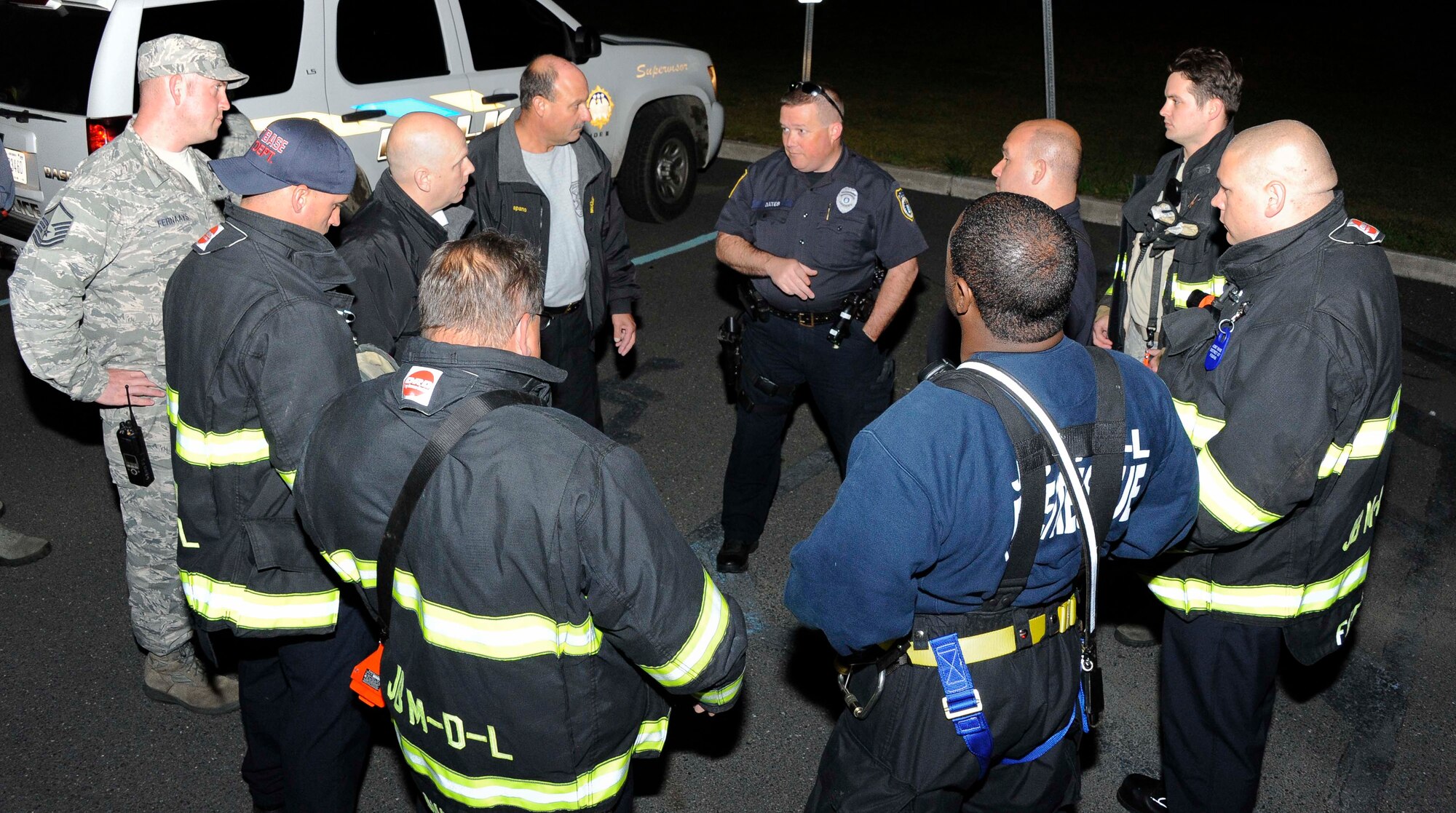Joint Base Fire Department firefighters rally at the Fort Dix Elementary School after the disappearance of 13-year-old joint base military family member May 8, 2013, at Joint Base McGuire-Dix-Lakehurst, N.J. The teenager was reunited safely with her family after being found walking along Route 206 at approximately 11 a.m. May 9, 2013. (U.S. Air Force photo by Airman 1st Class Ryan Throneberry/Released)
