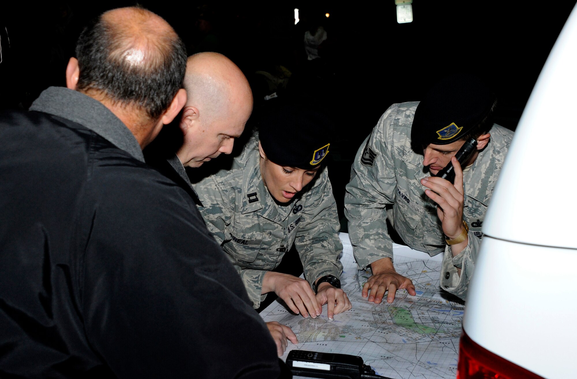 Capt. Shannon O'Neal, 87th Security Forces Squadron Operations officer in charge, organizes a search after the disappearance of 13-year-old joint base military family member May 8, 2013, at Joint Base McGuire-Dix-Lakehurst, N.J. The teenager was reunited safely with her family after being found walking along Route 206 at approximately 11 a.m. May 9, 2013. (U.S. Air Force photo by Airman 1st Class Ryan Throneberry/Released)