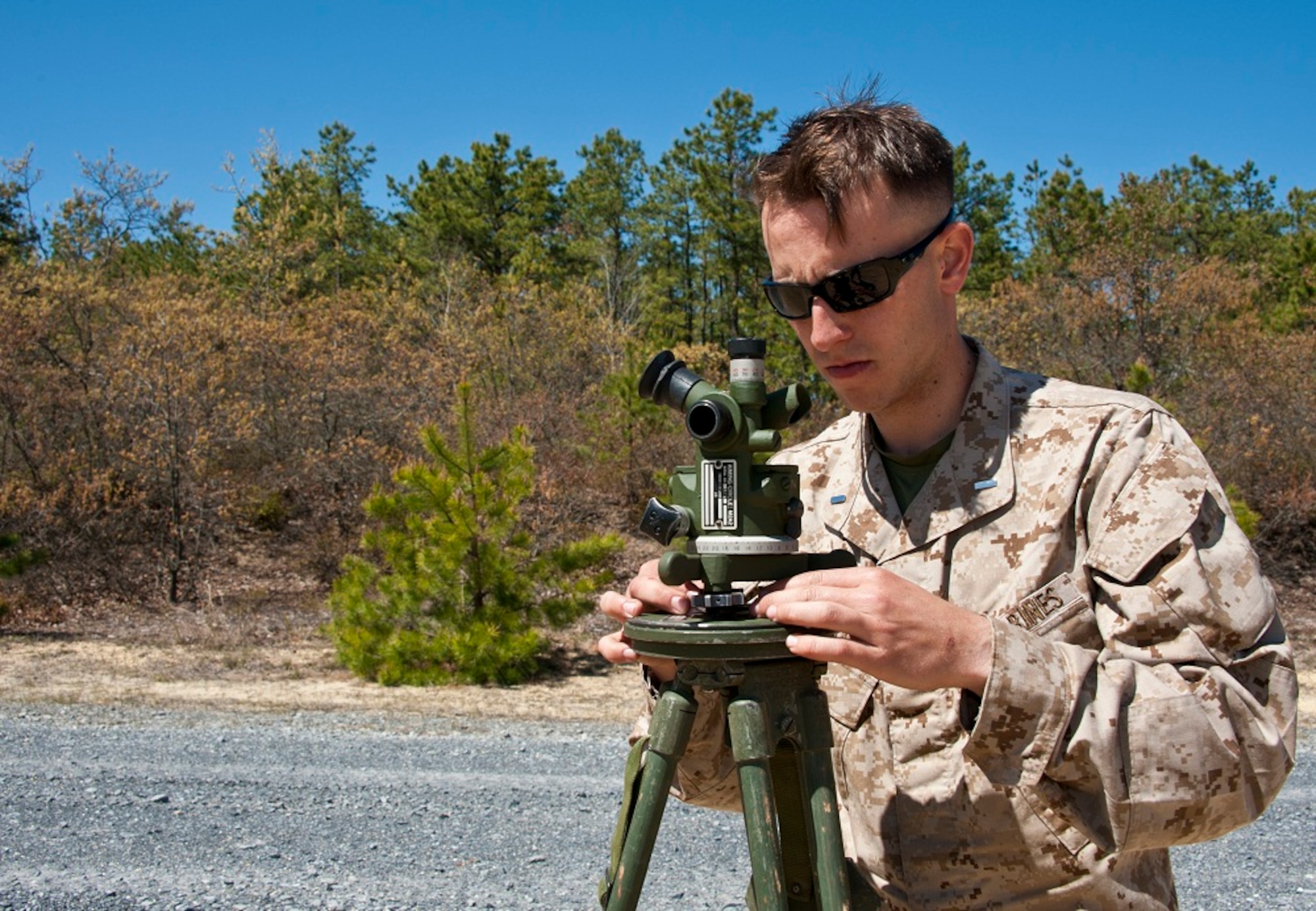1st. Lt. Scott Roman, Golf Battery 3rd Battalion, 14th Marine Regiment assistant executive officer and rifle platoon commander, adjusts an M2A2 aiming circle during artillery training May 4, 2013, on the Joint Base McGuire-Dix-Lakehurst ranges. Roman is a Monroe Township, N.J., native and a graduate of Manhattan College in New York, N.Y. (U.S. Air Force photo by Staff Sgt. David Carbajal/Released)