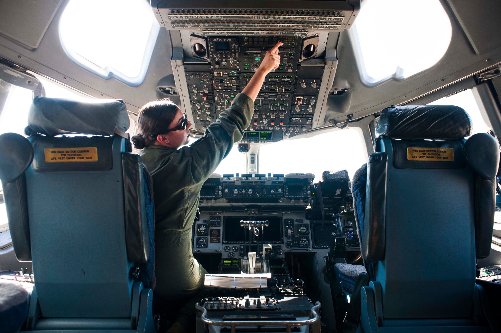 1st Lt. Maria Juliano, 6th Airlift Squadron pilot, performs a preflight checklist on a C-17 Globemaster III May 2, 2015, on Joint Base McGuire-Dix-Lakehurst, N.J. The 6th AS is the oldest airlift squadron in the Air Force, providing global air mobility using the C-17. Juliano hails from Branchburg, N.J. (U.S. Air Force photo by Russ Meseroll/Released)
