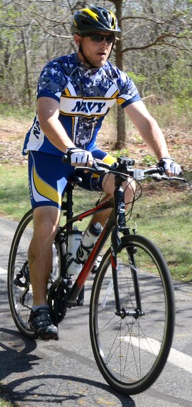 Navy Petty Officer 2nd Class John Lewis trains daily for a 150-mile bike ride this fall. The event has not only helped him lose weight and become healthier but, “It’s an opportunity to help other people.” (Air Force photo by Kelly White)