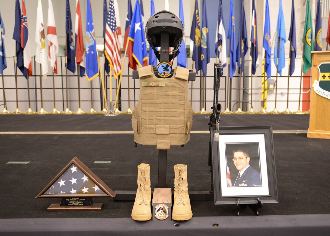 A fallen warrior display honors Staff Sgt. Richard Dickson at a memorial service, May 6, on Beale Air Force Base, Calif.  Dickson, a 306th Intelligence Squadron airman, and Capt. Reid Nishizuka, from the 427th Reconnaissance Squadron, were among four MC-12 crew members who perished when their aircraft went down in Afghanistan, April 27, 2013. (U.S. Air Force photo/John Schwab)