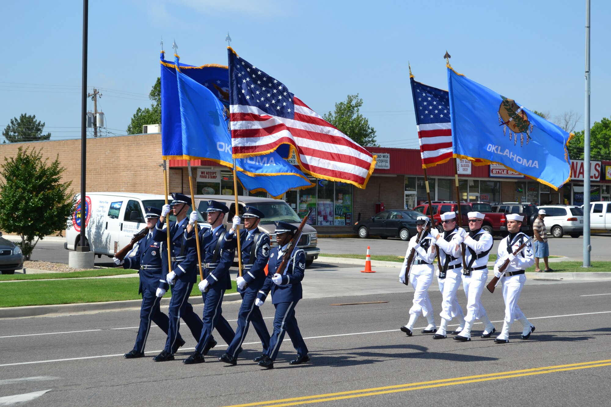 With flags flying, Tinker Honor Guards marched in last year’s Armed Forces Day Parade in Del City. This year’s parade is May 11 and Col. Steven J. Bleymaier, 72nd Air Base Wing commander, is the grand marshal. The parade starts at 
10 a.m. at the Howard Memorial Baptist Church, on the corner of Reno Avenue and Sunnylane Road. It proceeds south on Sunnylane to SE 29th Street, turns east onto SE 29th Street and goes to Linda Lane. (Air Force photo by Kathy Paine)