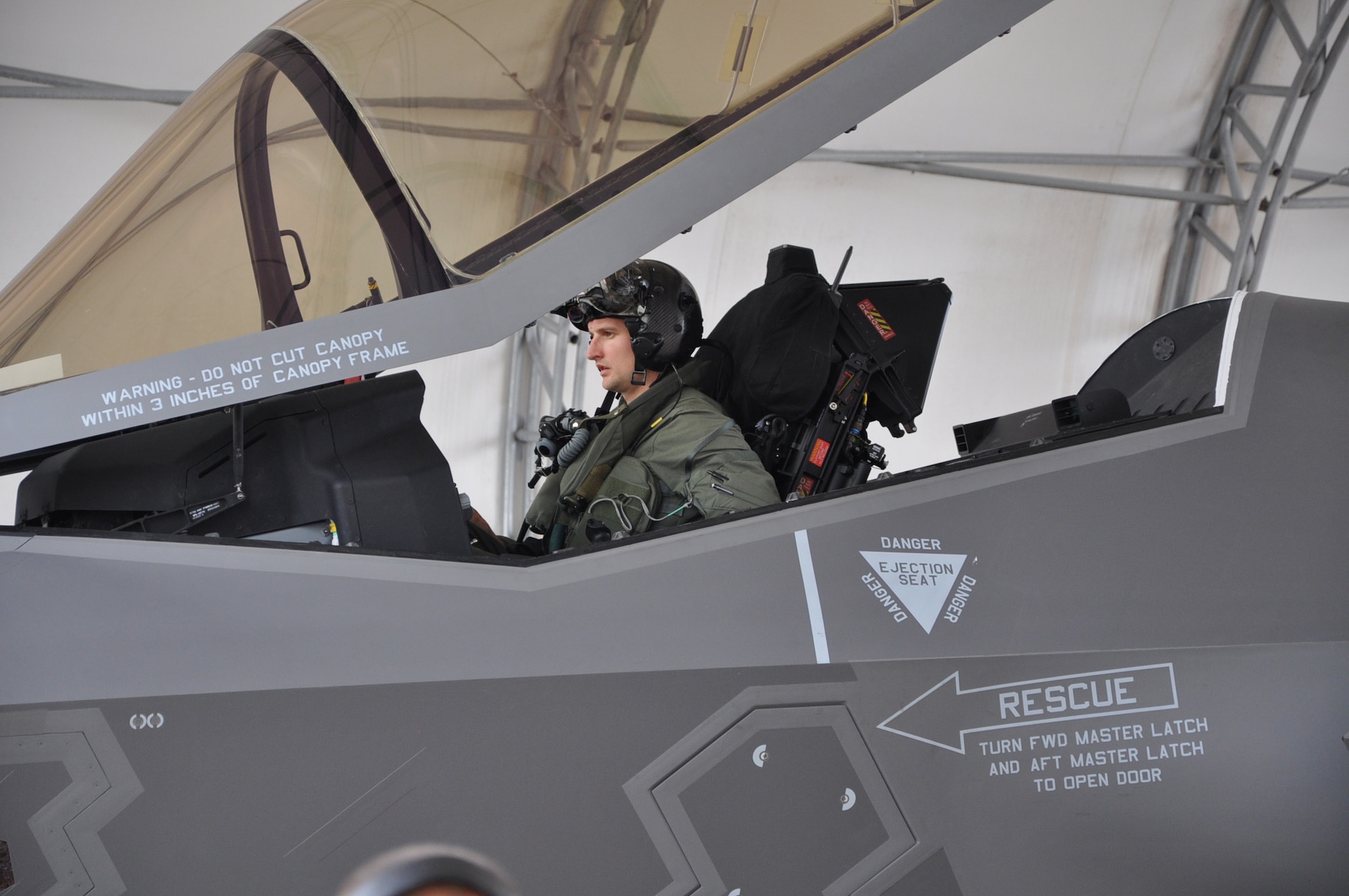 Maj. Matthew Johnston, 58th Fighter Squadron, instructor pilot, opens the canopy of the Advanced F-35 Lighting II joint strike fighter after arriving at Eglin Air Force Base, Fla., May 6, 2013. The F-35 will be used in training all military branch F-35 pilots on the new software and sensors in the aircraft.(U.S. Air Force photo by Staff Sgt. Nicholas Egebrecht)