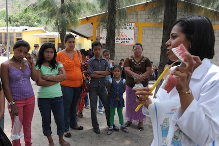 A Honduran Ministry of Health employee explains how to maintain good oral hygiene to the locals during a Medical Readiness exercise, May 6. Joint Task Force-Bravo partnered with Honduran Ministry of Health and Honduran military personnel, to provide medical services to more than 500 Cuesta de la Virgen community members. (Photo by Martin Chahin)