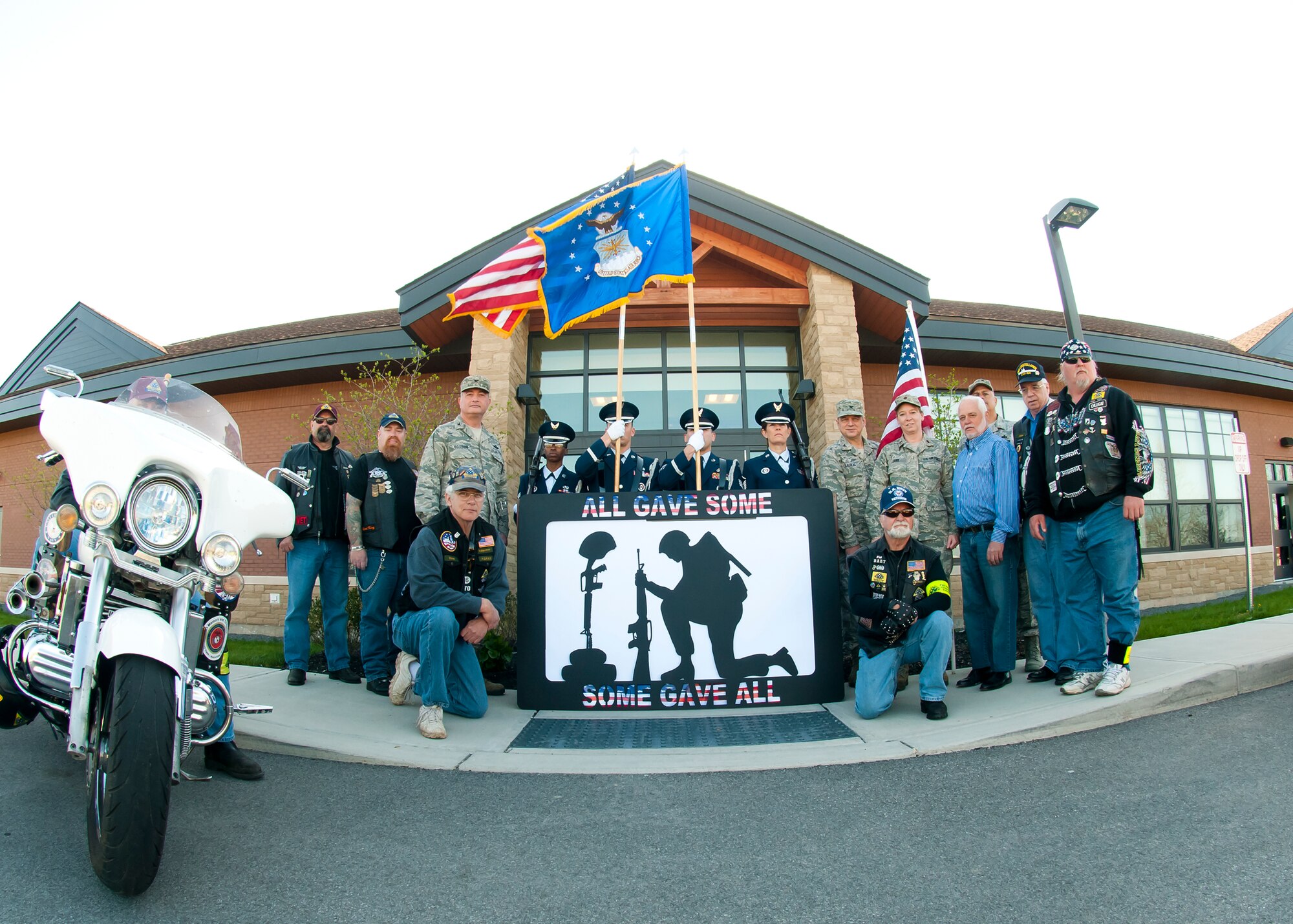 Members of the 914th Airlift Wing accept a sculpture donated by the local chapter of the Patriot Riders, May 5, 2013, Niagara Falls Air Reserve Station, N.Y. The piece titled “Never Forget Silhouette” was created by a Vietnam Veteran, Dan DeCrow to honor the War Dead and Veterans from World War One to the present. This display will be be added to the Heritage Room in the NFARS Community Activity Center. (U.S. Air Force photo by Tech. Sgt. Joseph McKee)  