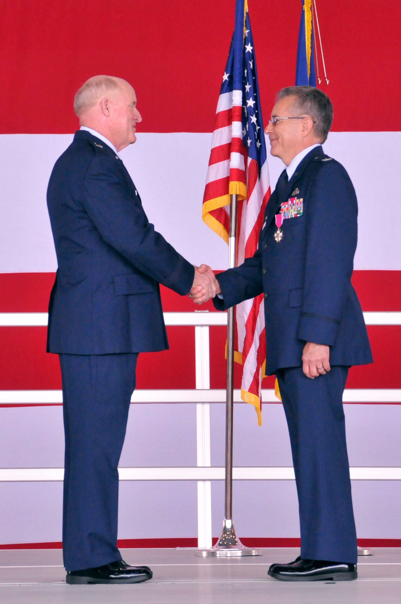 Brig. Gen. Randolph C. Ryder Jr., mobilization assistant to the Director, Plans and Programs, Headquarters Air Force Reserve Command, shakes hands with Col. Gerald Micheletti during Micheletti’s retirement ceremony at Homestead Air Reserve Base, Fla., May 4. Micheletti was the commander of the 482nd Maintenance Group from July 17, 2011, to May 1, 2013. (U.S. Air Force photo/Senior Airman Nicholas Caceres)