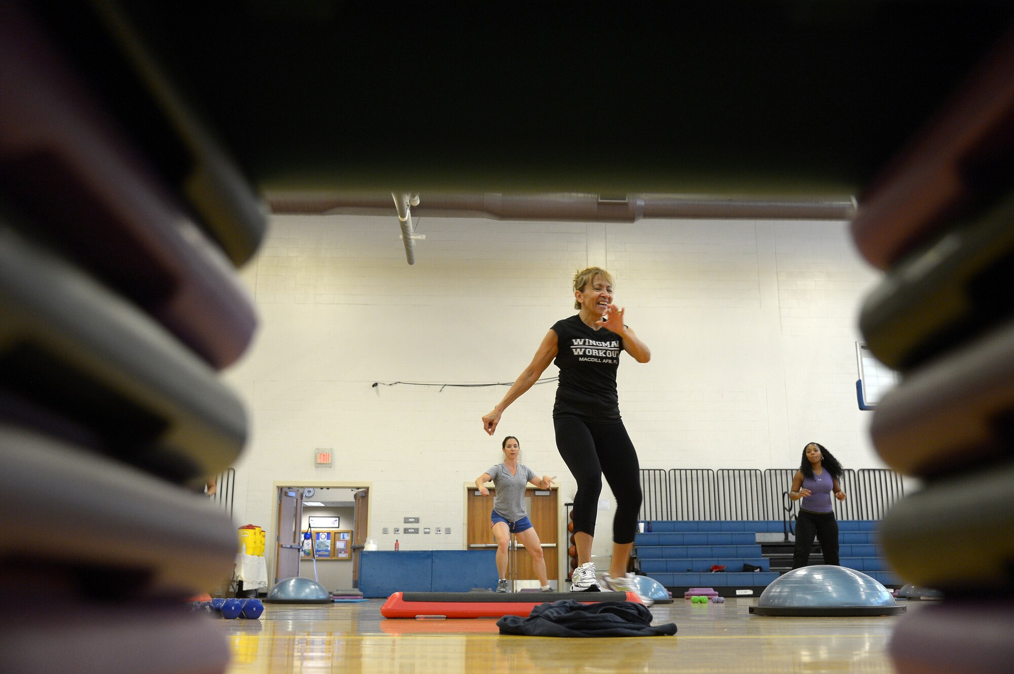 Ofelia McCray, aerobic coordinator, teaches an aerobics class during the Aerobathon at MacDill Air Force Base, Fla., May 8, 2013.The aerobathan was put on by the 6th Force Support Squadron in honor of May being National Physical Fitness and Sports Month. (U.S. Air Force photo by Airman 1st Class Tori Schultz/Released)