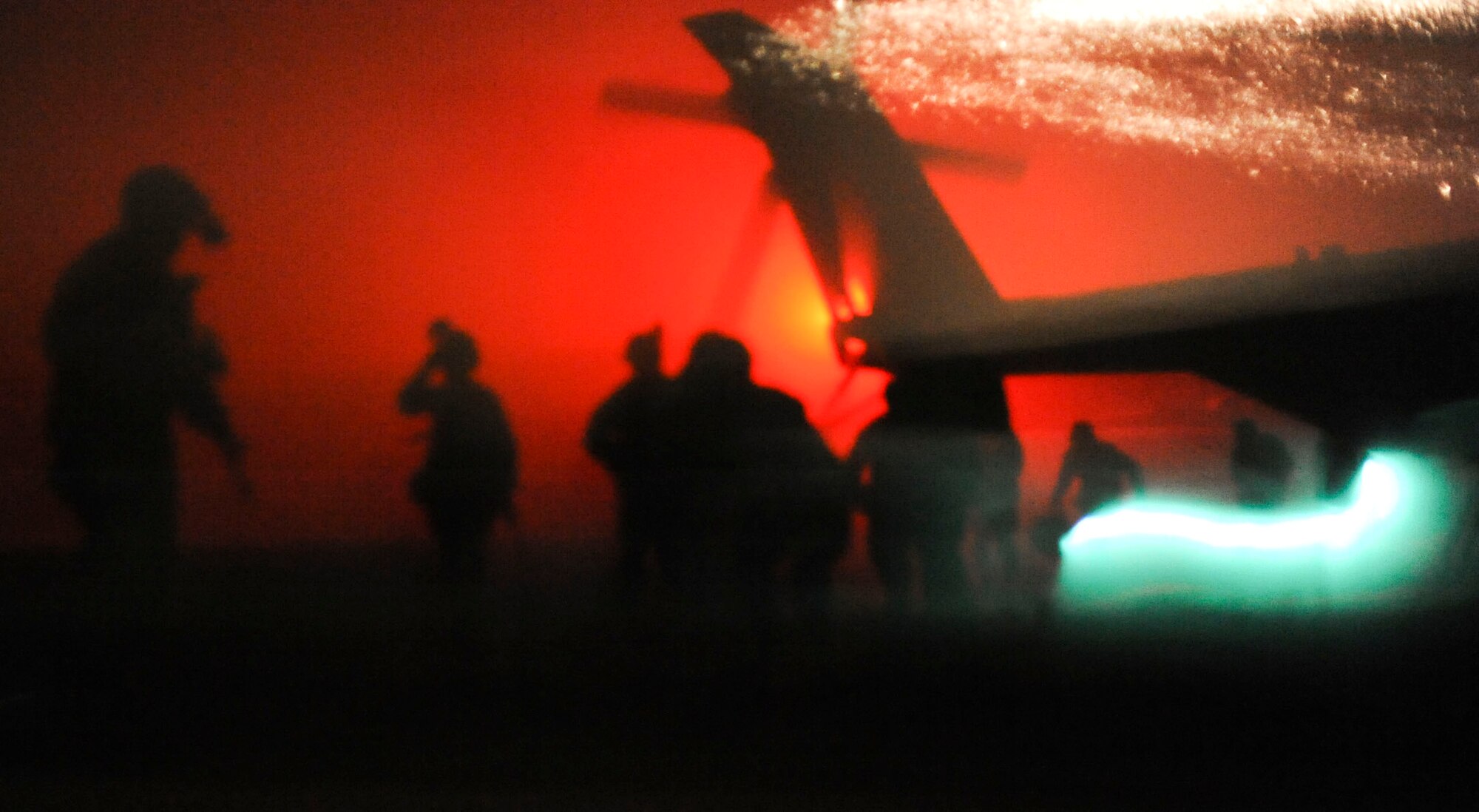 Marine Heavy Helicopter Squadron 772 Marines exit a CH-53 Super Stallion during a Tactical Recover of Aircraft and Personnel rehearsal exercise at night April 30, 2013, on the Dix ranges at Joint Base McGuire-Dix-Lakehurst, N.J. The moonless night forced Marines to utilize night-vision equipment to locate the downed personnel in the surrounding woods.(U.S. Air Force photo by Airman Sean M. Crowe/Released)