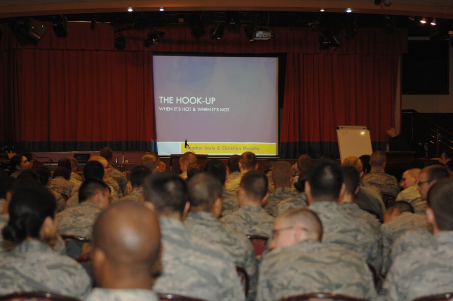 Team Mildenhall Airmen wait for the presentation “The Hook-up” to begin May 8, 2013, at the Galaxy Club on RAF Mildenhall, England. “The Hook-up” is a presentation geared toward Airmen ages 18 to 25 and it covered topics such as sexual assault and how to prevent it. (U.S. Air Force photo by Airman 1st Class Dillon Johnston/Released)