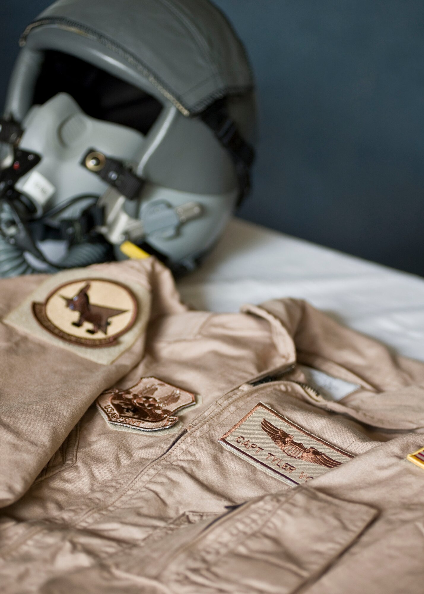 A flight suit is displayed in honor of Capt. Mark "Tyler" Voss during a memorial service May 9, 2013, at Transit Center at Manas, Kyrgyzstan. Voss was a 22nd Expeditionary Air Refueling Squadron KC-135 Stratotanker pilot who perished in an aircraft accident on May 3, 2013. He was deployed from Fairchild Air Force Base, Wash., and was a native of Boerne, Texas. (U.S. Air Force photo/Staff Sgt. Stephanie Rubi) 
