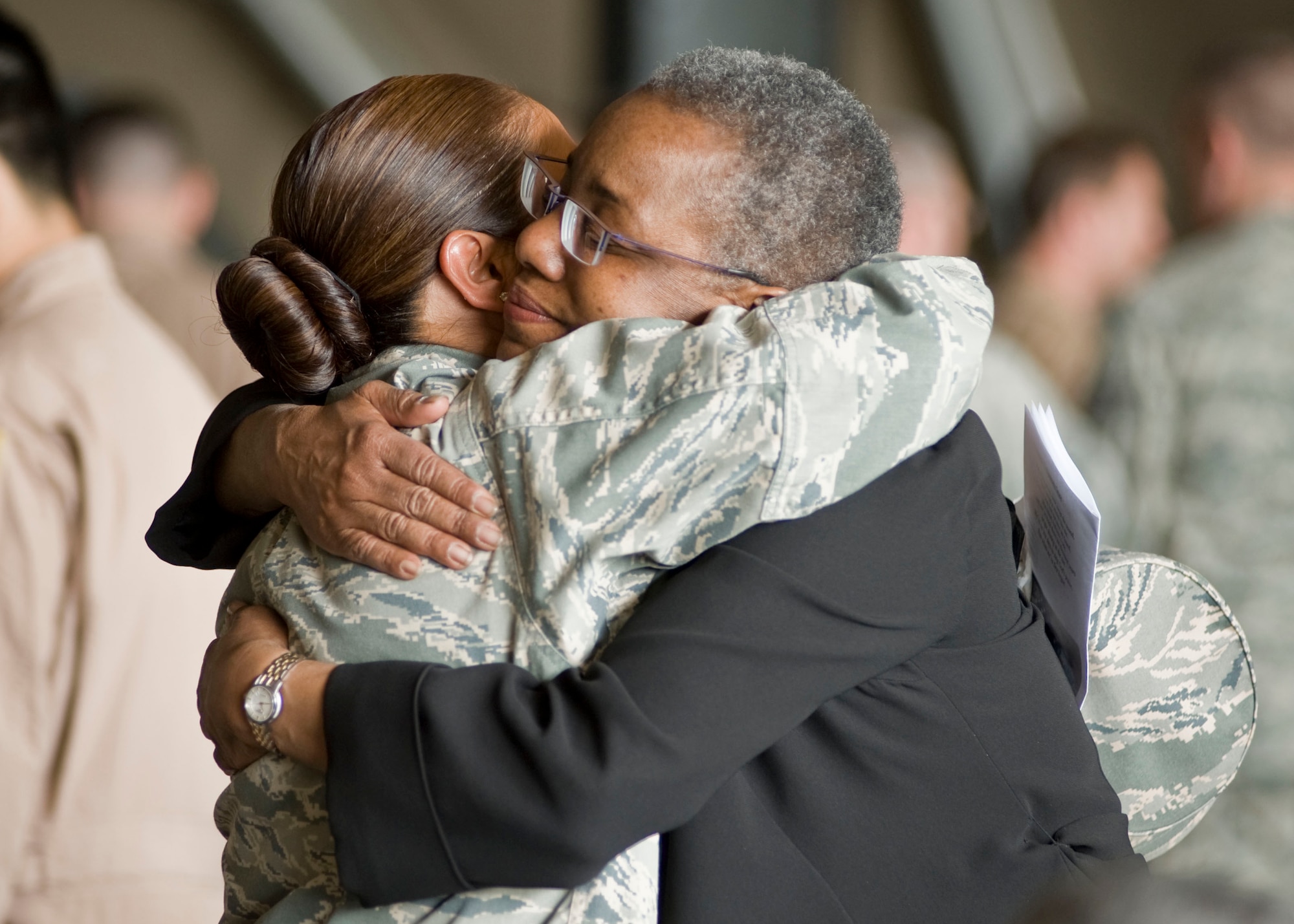 Col. Shirlene Ostrov, 376th Expeditionary Mission Support Group commander, shares a comforting hug with Pamela Spratlen, U.S. Ambassador to Kyrgyzstan, after a memorial service May 9, 2013, at Transit Center at Manas, Kyrgyzstan. Spratlen visited the Transit Center to pay her respects to Capt. Mark "Tyler" Voss, Capt. Victoria "Tori" Pinckney, and Tech. Sgt. Herman "Tre" Mackey III. (U.S. Air Force photo/Staff Sgt. Stephanie Rubi)