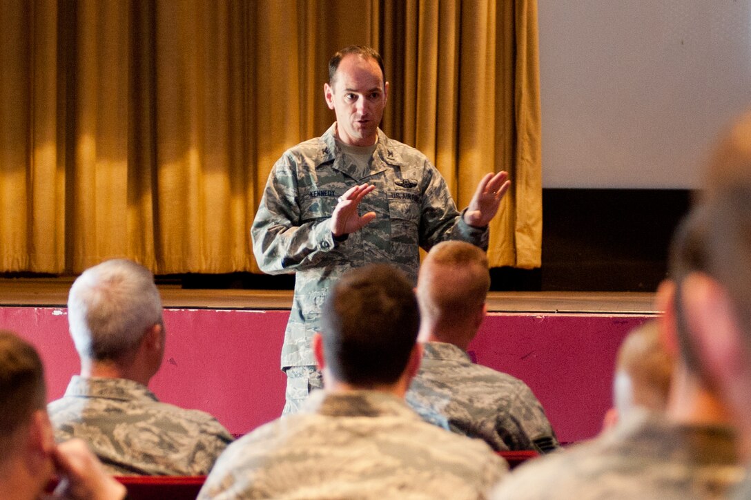 Col. Kevin Kennedy, 28th Bomb Wing commander, addresses more than 100 motorcycle enthusiasts during a Motorcycle Safety Day meeting at the base theater on Ellsworth Air Force Base, S.D., May 6, 2013. Along with Kennedy, representatives from the28th Bomb Wing Safety Office, Box Elder Police Department, and the Green Knights Dakota Thunder Military Motorcycle Club spoke about the many aspects of motorcycle safety. (U.S. Air Force photo by Senior Airman Kate Maurer/Released)
