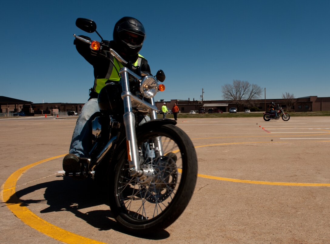 Staff Sgt. Hunter Neutzling, 28th Aircraft Maintenance Squadron B-1 crew chief, completes an “S” curve turn during a beginners motorcycle safety course on Ellsworth Air Force Base, S.D., May 3, 2013. The “S” curve exercise helps riders learn to shift their weight on the bike which could help them avoid hazardous situations later on the road. (U.S. Air Force photo by Senior Airman Kate Maurer/Released)