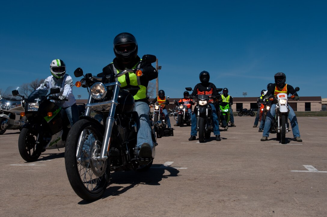 A group of motorcycle riders move forward to begin a riding exercise during a beginners motorcycle safety course on Ellsworth Air Force Base, S.D., May 3, 2013. Motorcycle safety courses are open to all base riders and are free of charge. For more information, call the base Safety Office at (605) 385-7233. (U.S. Air Force photo by Senior Airman Kate Maurer/Released)