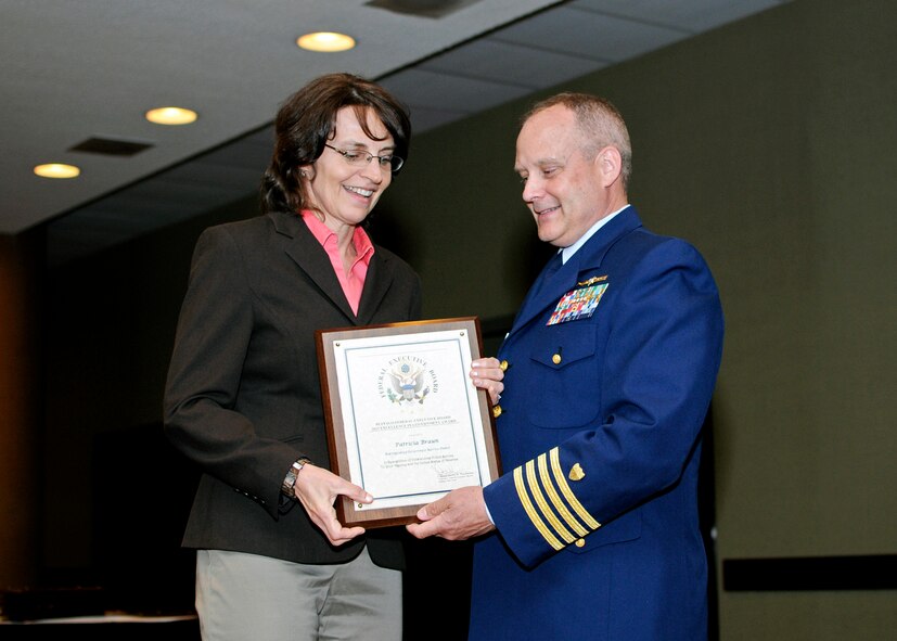 U. S. Air Force Col. Patricia Braun (Ret), 914th Airlift Wing receives the Distinguished Government Service Award from the Buffalo Federal Executive Board, May 8, 2013, Buffalo, N.Y. The Buffalo Federal Executive Board Excellence in Government luncheon celebrating excellence in public service was held in the Buffalo convention center. (U.S. Air Force photo by Tech. Sgt. Joseph McKee) 