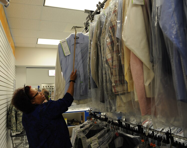 Brenda Dukes, Army & Air Force Exchange Service cleaners, takes a shirt off a rack on Barksdale Air Force Base, La., May 8, 2013. The AAFES Cleaners gives members of Team Barksdale convenient on-base dry cleaning services. (U.S. Air Force photo/Airman 1st Class Benjamin Gonsier)