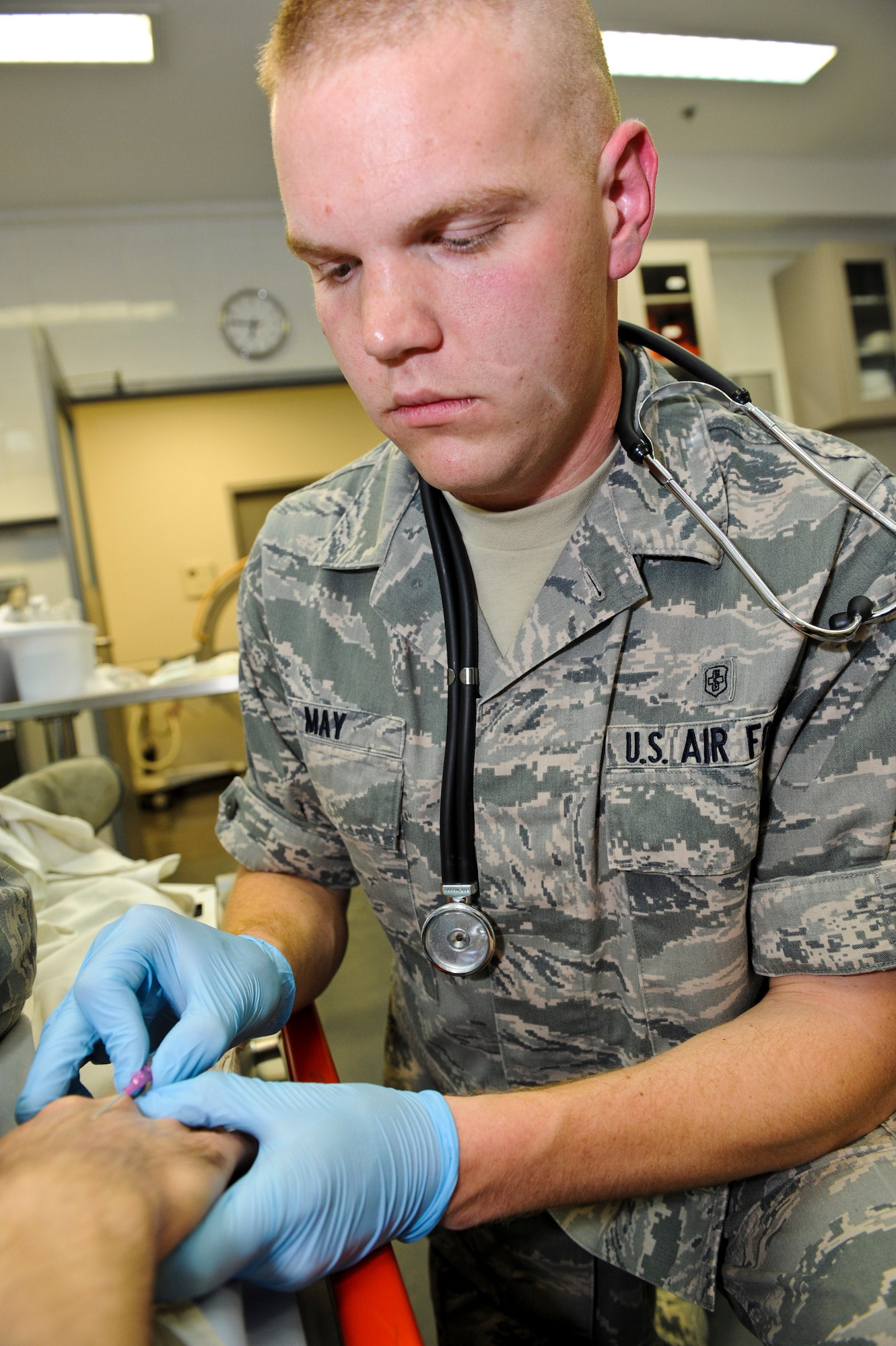 Airman 1st Class Joshua May, 379th Expeditionary Medical Operations Squadron medical technician, inserts an IV needle into a mock patient’s vein as he practices his skills, May 9, 2013, at the 379th Air Expeditionary Wing’s medical facility. May deployed here from Joint Base Langley-Eustis, Va. The Air Force Medical Service celebrates Nurse and Medical Technician week May 6 - 12. (U.S. Air Force photo/Senior Airman Benjamin Stratton)