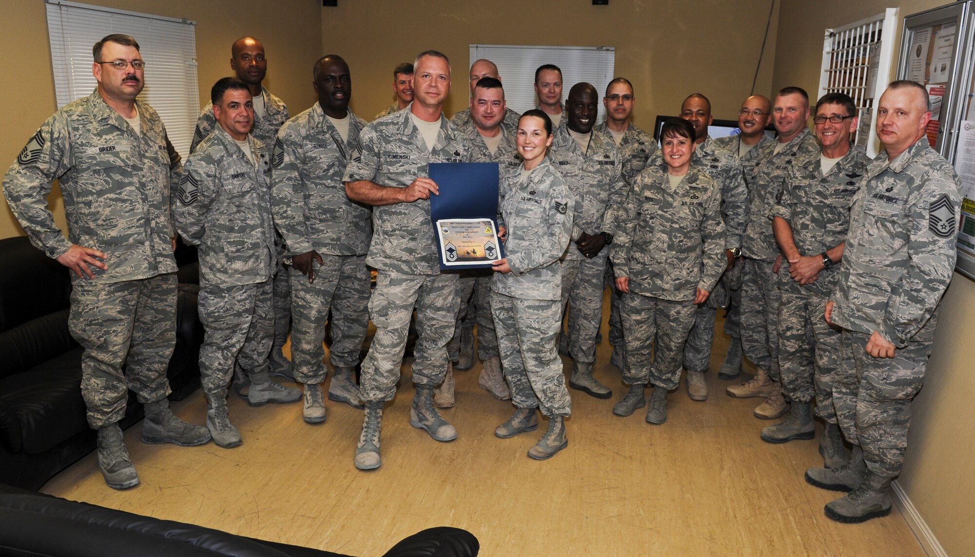 SOUTHWEST ASIA -- Staff Sgt. Melissa Clouatre, 379th Expeditionary Comptroller Squadron customer service NCO in charge, receives recognition by the  379th Air Expeditionary Wing Desert Chief’s Group for superior performance, May 8, 2013. Clouatre deployed here from Malmstrom Air Force Base, Mont. (U.S. Air Force photo/Senior Airman Benjamin Stratton)