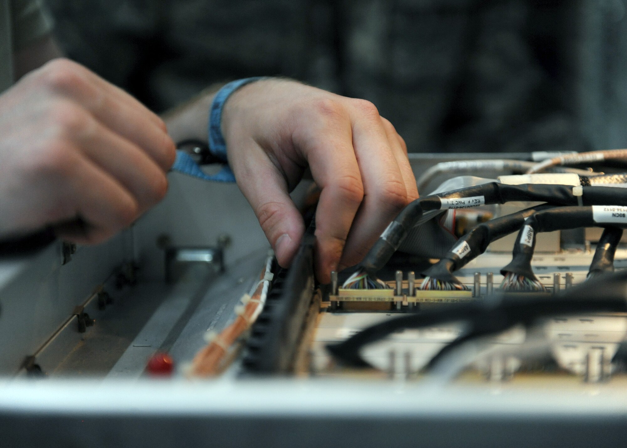 SOUTHWEST ASIA -- Electronic warfare maintainers from the 763rd Expeditionary Reconnaissance Squadron calibrate systems onboard a RC-135V/W Rivet Joint May 6, 2013, at the 379th Air Expeditionary Wing. The RC-135’s are primarily used as an intelligence, surveillance and reconnaissance platform; picking up real-time information on oppositional forces. All RC-135s are assigned to Air Combat Command being permanently based at Offutt Air Force Base, Neb., using various forward deployment locations worldwide. (U.S. Air Force photo/Staff Sgt. Joel Mease)