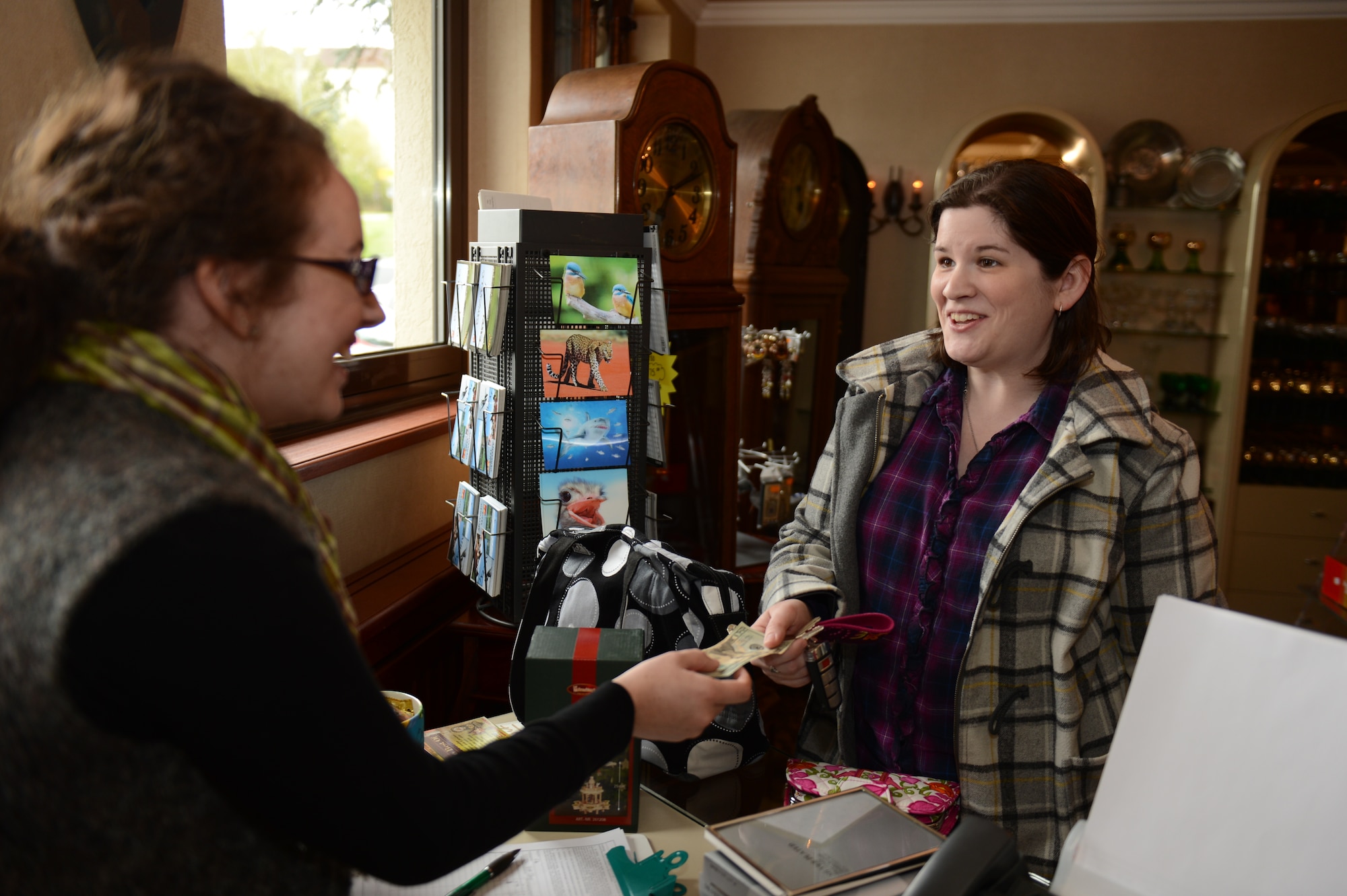 SPANGDAHLEM AIR BASE, Germany – Andrea Sprinkle, wife of U.S. Air Force Tech. Sgt. Brett Sprinkle from Austin, Texas, 52nd Maintenance Operations Squadron, purchases a candle windmill at Toni’s Gift Shop April 30, 2013. Toni’s Gift Shop has been relocated to the Saber Conference Center, previously titled the Wilkommen Center. The move is part of a renovation project funded through the Nonappropriated Fund Small Projects Program, which is money generated through sales at 52nd Force Support Squadron facilities versus tax-payer dollars. (U.S. Air Force photo by Airman 1st Class Gustavo Castillo/Released)