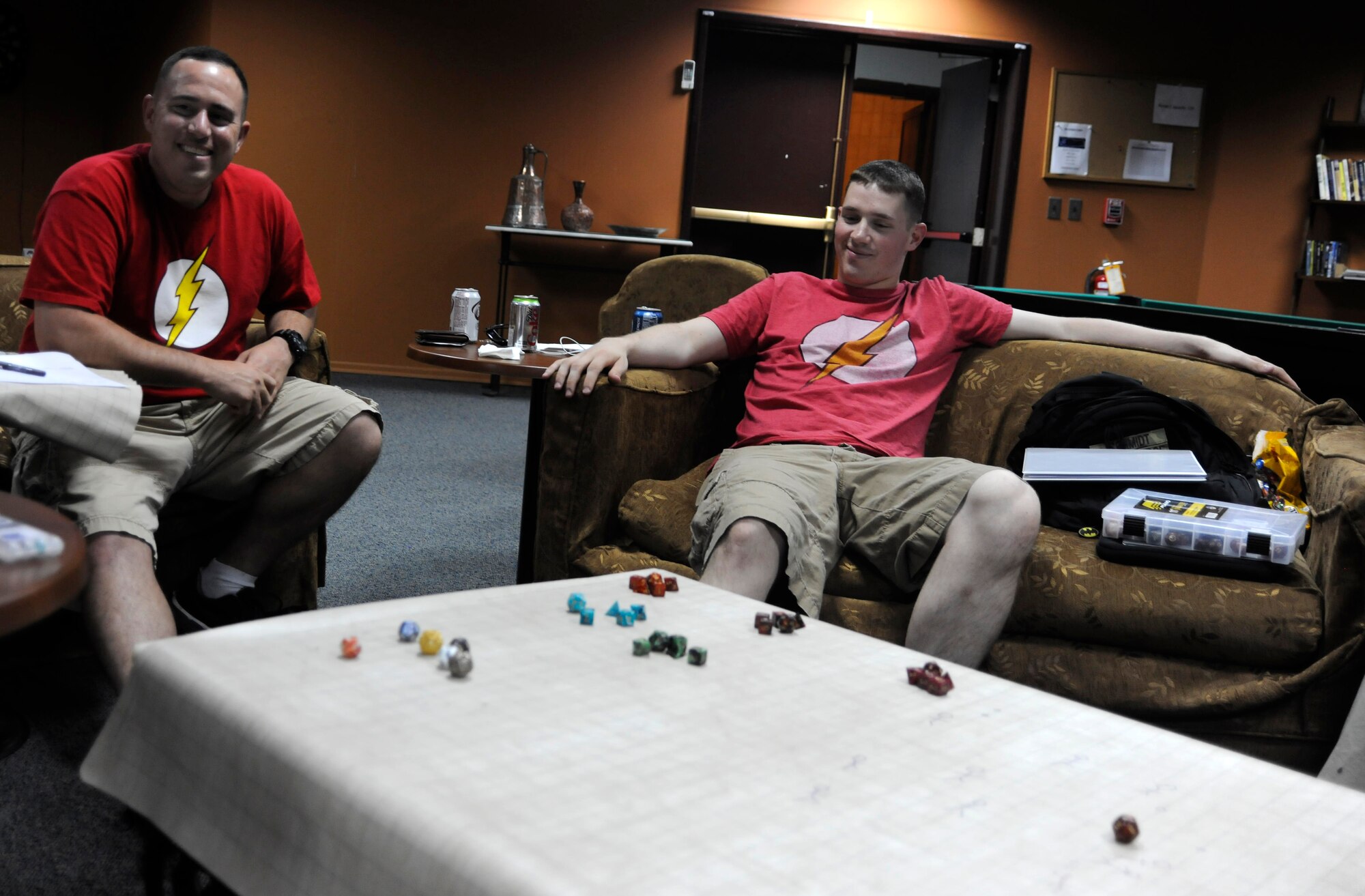 Tech. Sgt. Dustin Hayes, left, and Senior Airman Alric Schmidt, members of the Incirlik Tabletop Warriors, relax while listening to instructions during a role-playing game May 8, 2013, at Incirlik Air Base, Turkey. Members of ITTW play a wide variety of games, and are open to trying almost any game available. (U.S. Air Force photo by Senior Airman Anthony Sanchelli/Released)
