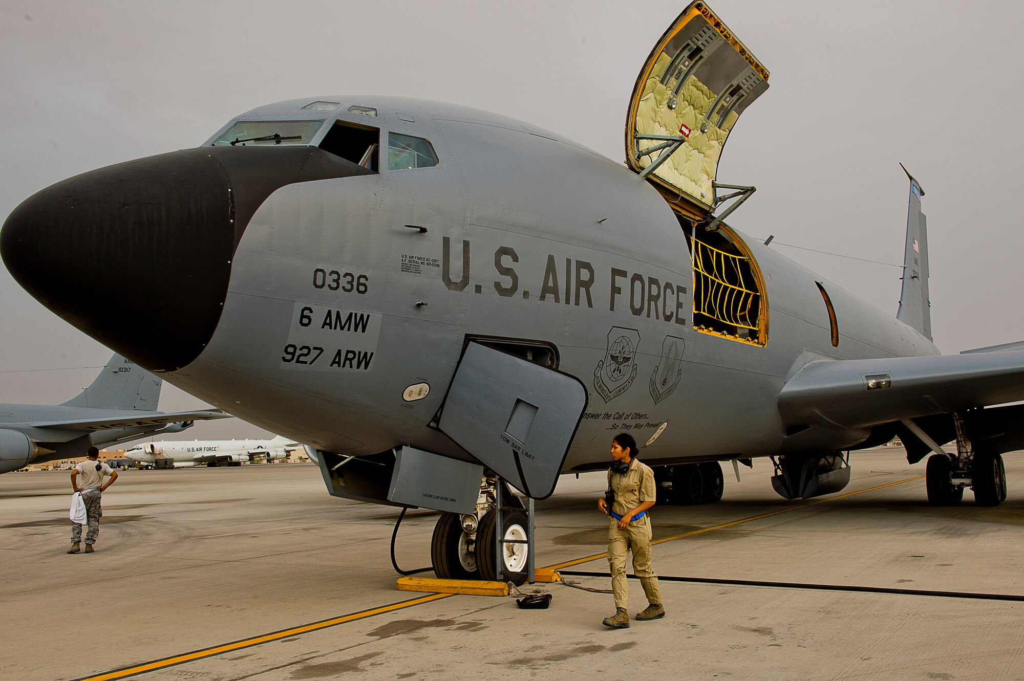 Ground maintenance crew members prepare and inspect a KC-135 Stratotanker before a refueling mission at an undisclosed air base, Southwest Asia, April 25. Refueling missions here support air operations in, and around, Afghanistan as part of Operation Enduring Freedom. (U.S. Air Force photo/Staff Sgt. Alexander Martinez)