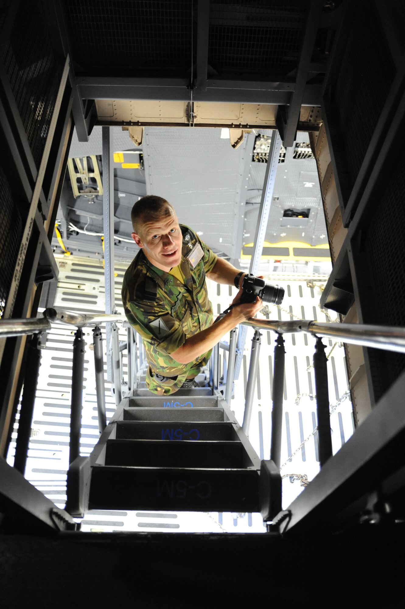 Master Sgt. Juan Chapa, 728th Mobility Squadron production superintendent, explains landing gear operations during a tour of a U.S. Air Force C-5M Super Galaxy cargo aircraft provided to five members of the Dutch army and the 39th Air Base Wing Host Nation Advisor, a Turkish national, May 7, 2013 at Incirlik Air Base, Turkey. The Dutch are deployed to Incirlik AB to operate Patriot missile batteries as part of a NATO mission intended to show solidarity with the country of Turkey and to deter against potential Syrian aggression. (U.S. Air Force photo by 1st Lt. David Liapis/Released)