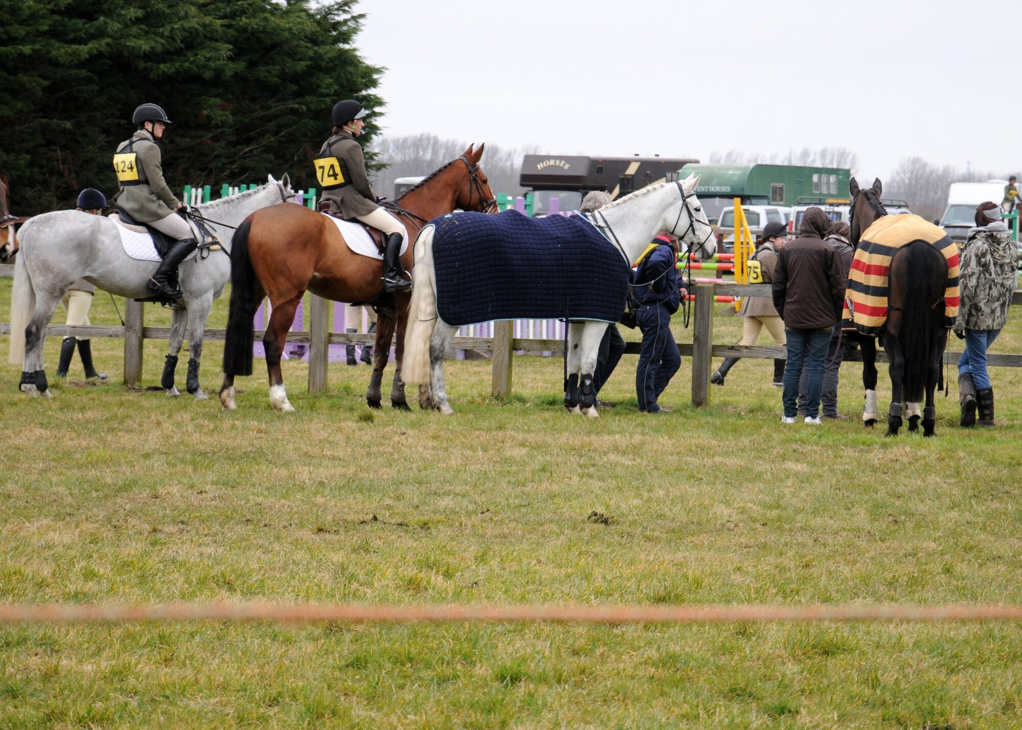Riders and their horses wait for a show jumping event to begin at Soham Pony Club grounds. In show-jumping, horses need to be careful not to knock the poles off, while still run at a fast pace so as not to incur time penalties. Many Pony Clubs encourage healthy competition among its members by having show jumping teams. (Courtesy photo by Gina Randall)
