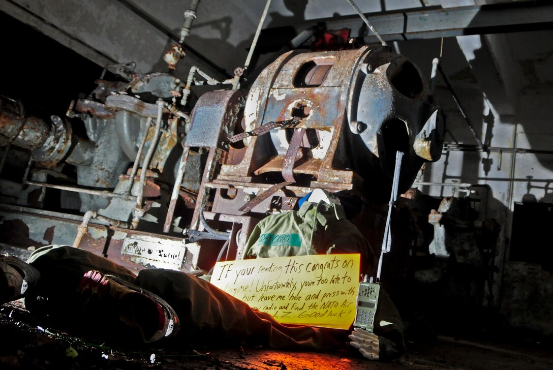 “Sergeant Castro” awaits rescue in an underground water well during a 36th Mobility Response Squadron training day on Andersen Air Force Base, Guam, May 2, 2013. Close to the end of the course, 36th MRS members learn that the simulated, stranded paratrooper was diseased and it was up to the Airmen to continue his mission to complete training. (U.S. Air Force photo by Airman 1st Class Marianique Santos/Released)