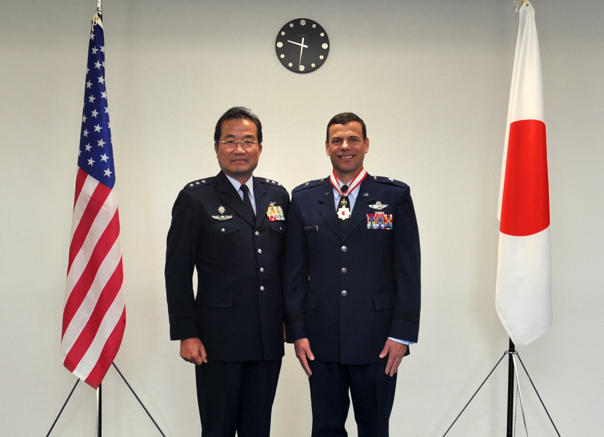 Japan Air Self Defense Force Lt. Gen. Yoshiyuki Sugiyama, commander, Southwestern Composite Air Division & Okinawa Area coordinator at Naha Air Base, presents the Order of the Rising Sun (Kyokujitsu-sho in Japanese) to Brig. Gen. Matt Molloy, 18th Wing commander, at Naha AB, Japan, May 9, 2013. This prestigious award was originally established in 1875 by Emperor Meiji and was the first national decoration awarded by the Government of Japan. The order is awarded to those who have made distinguished achievements in international relations, promotion of the Japanese culture, and advancements in their field. (U.S. Air Force photo by Naoto Anazawa/Released)