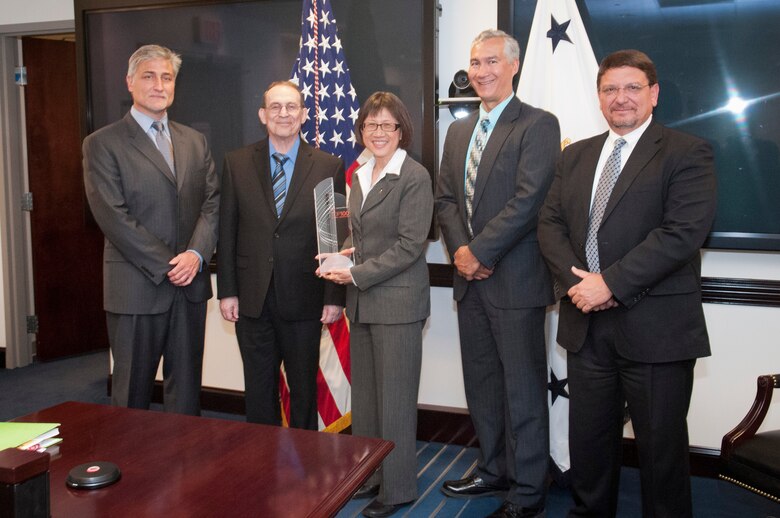 The U.S. Army has been named one of the 2012 Top100 Global Innovators by Thomson Reuters, the multimedia and information conglomerate. Pictured with the award are Bob Barbour, senior vice president, Global Sales for IP Solutions; Thomson Reuters, Ronald E. Meyers of the Army Research Laboratory; Heidi Shyu, assistant secretary of the Army for Acquisition, Logistics and Technology; John E. Nettleton of the Communications-Electronics Research, Development and Engineering Center; and Bartley Durst of the Engineer Research and Development Center (Corps of Engineers).
