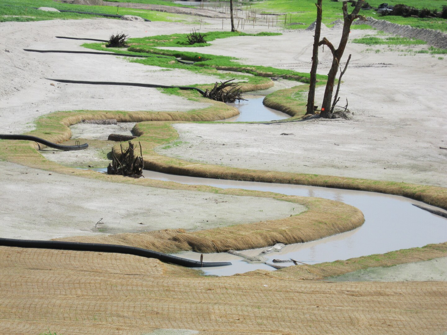 Florida law requires reclamation of each individual acre of land that is mined, to make it suitable for beneficial use or habitat. In 2002, the Florida Department of Environmental Protection Bureau of Mine Reclamation issued a report that 63 percent of land mined between 1975 and 2002 had been reclaimed and released. At left, the beginning stages of a stream restoration effort.