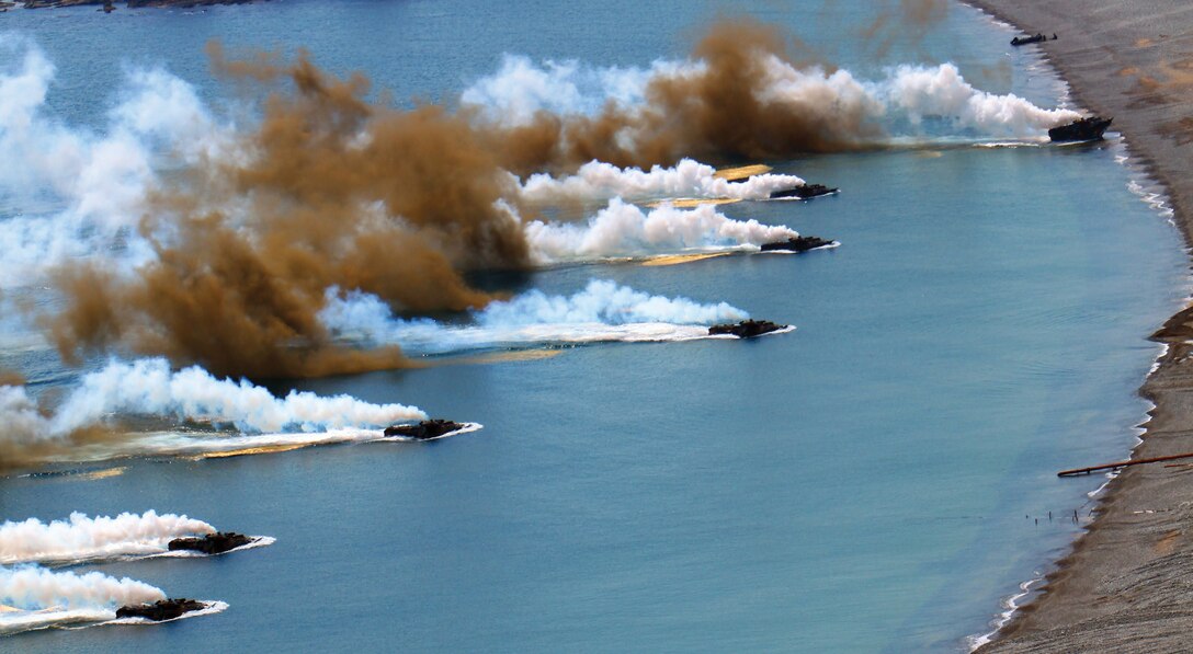 Republic of Korea Marine Corps assault amphibious vehicles advance past a smoke screen as their crews execute an amphibious landing at Doksuk-ri Beach April 26 in the Republic of Korea during Exercise Ssang Yong 13. Ssang Yong, which means “twin dragons” in Korean, is an annual bilateral training exercise in the ROK designed to strengthen combat readiness and interoperability of U.S. and ROK forces. The landing was the culminating event of the annual exercise. The ROK Marines are with 1st ROK Marine Division. Photo by Lance Cpl. Jose D. Lujano