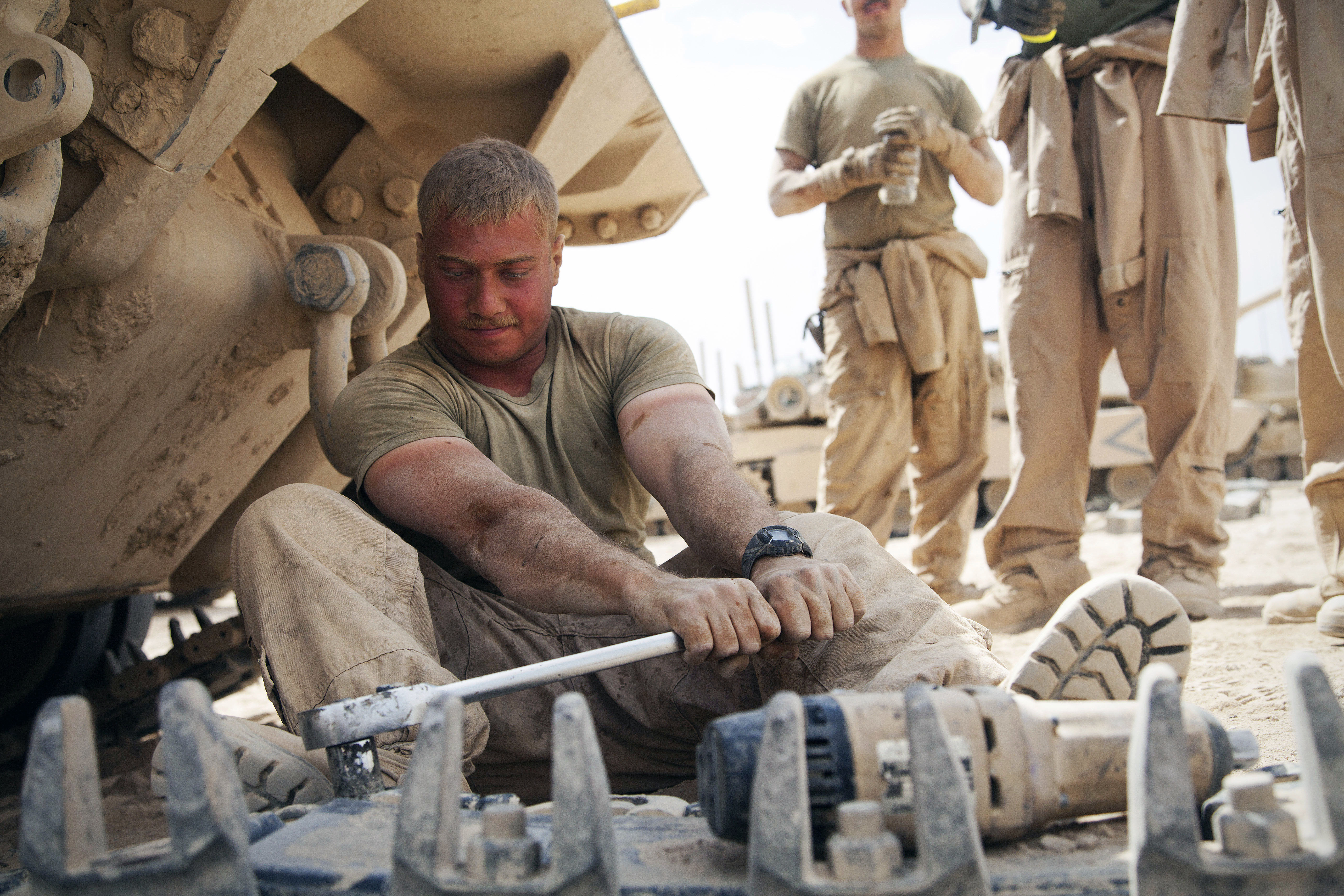 U.S. Marine Corps Sgt. Christopher Cannella starts to prepare a tank