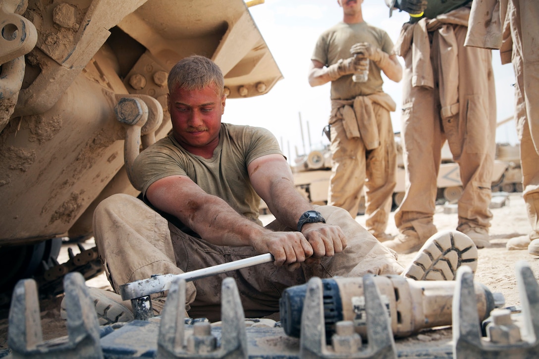 U.S. Marine Corps Sgt. Christopher Cannella starts to prepare a tank track while conducting maintenance on an M88A2 Hercules recovery vehicle at Forward Operating Base Shir Ghazay, Helmand province, Afghanistan, May 7, 2013. Cannella is a tank mechanic assigned to Delta Company, 1st Tank Battalion.