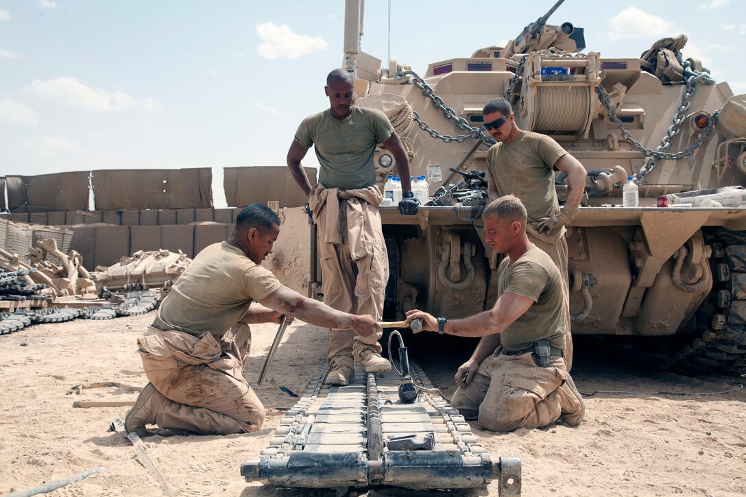 U.S. Marines conduct routine maintenance on an M88A2 Hercules recovery vehicle at Forward Operating Base Shir Ghazay, Helmand province, Afghanistan, May 7, 2013. The Marines are assigned to Delta Company, 1st Tank Battalion.