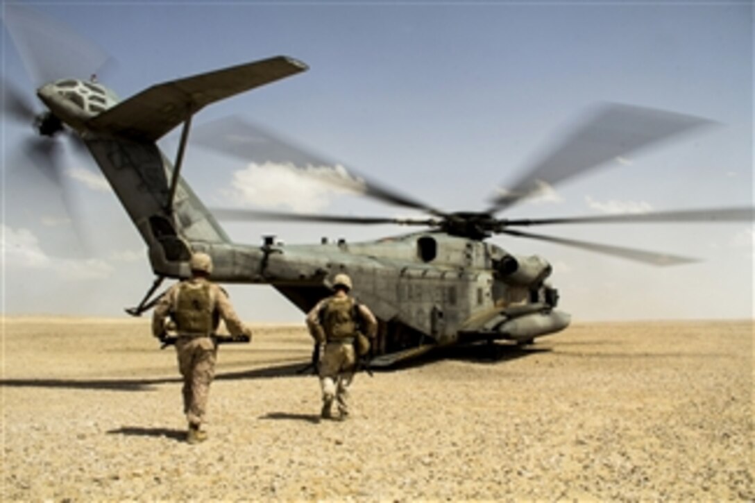 U.S. Marines and sailors load into a Marine Corps CH-53E Super Stallion helicopter after participating in exercise Eagle Resolve 2013 at Al Galail, Qatar, on May 3. 2013.  Eagle Resolve is an annual multilateral exercise designed to enhance regional cooperative defense efforts of the Gulf Cooperation Council nations and U.S. Central Command.  