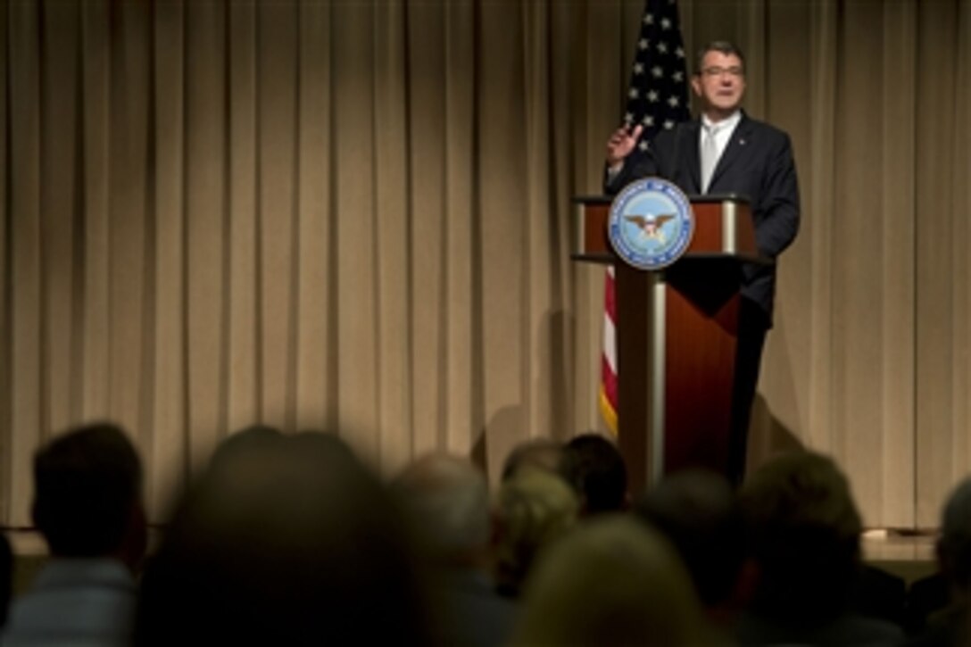 Deputy Secretary of Defense Ashton Carter addresses the audience at the Public Service Recognition Week awards ceremony in the Pentagon on May 8, 2013.  Carter thanked the 34 award recipients for their dedication to the department and to the country.  