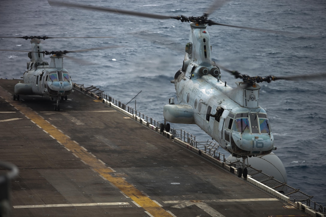 Two CH-46E Sea Knight helicopters with Marine Medium Helicopter Squadron 262 (Reinforced), 31st Marine Expeditionary Unit, take off during their final MEU deployment here, March 20. The flyover marked the final time the helicopters, also known as “Phrogs,” will be deployed as a squadron before rotating out for the MV-22 Osprey tiltrotor aircraft. The 31st MEU is the only continuously forward-deployed MEU and is the Marine Corps’ force in readiness in the Asia-Pacific region.