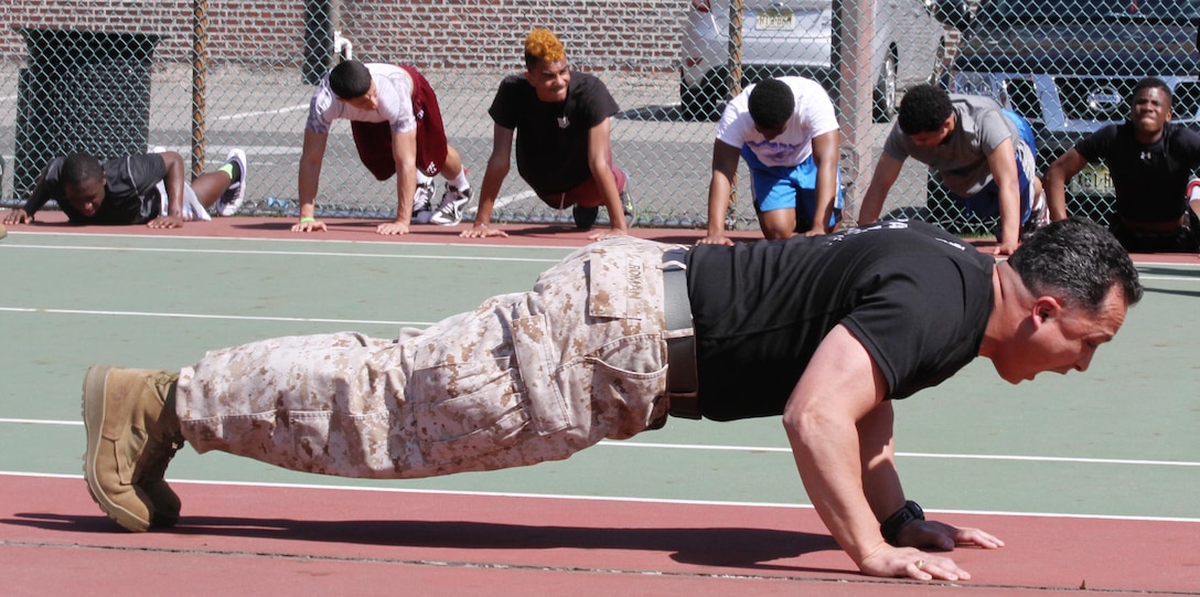 Gunnery Sgt. Nelson Roman, supply chief for Recruiting Station New Jersey, yells to motivate Bayonne High School football players during the leadership seminar at Bayonne High School, May 2nd, 2013. Roman has helped conduct more than 40 leadership seminars with Recruiting Station New Jersey. 