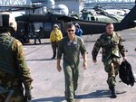 Brig. Gen. "Punch" Moulton, center, commander of U.S. Northern Command’s Standing Joint Force Headquarters, and his staff coordinate federal forces aboard the command ship USS Iwo Jima in New Orleans.