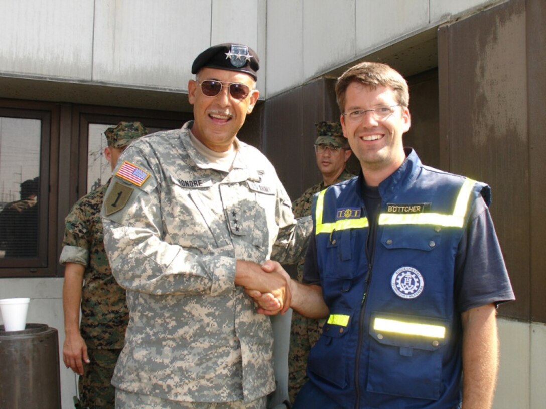 U.S. Army Lt. Gen. Russel L. Honore, commander and leader of the Katrina relief efforts, is seen here with Claus Bottcher, a reprersentative German Federation Agency for Technical Relief.                      