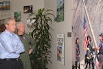 President George W. Bush and Adm. Timothy J. Keating, commander of U.S. Northern Command, take a moment to reflect at USNORTHCOM’s “9-11 Wall.” The president and Secretary of Homeland Security Michael Chertoff were at USNORTHCOM Sept. 23-24 to monitor Hurricane Rita from the USNORTHCOM Joint Operations Center.