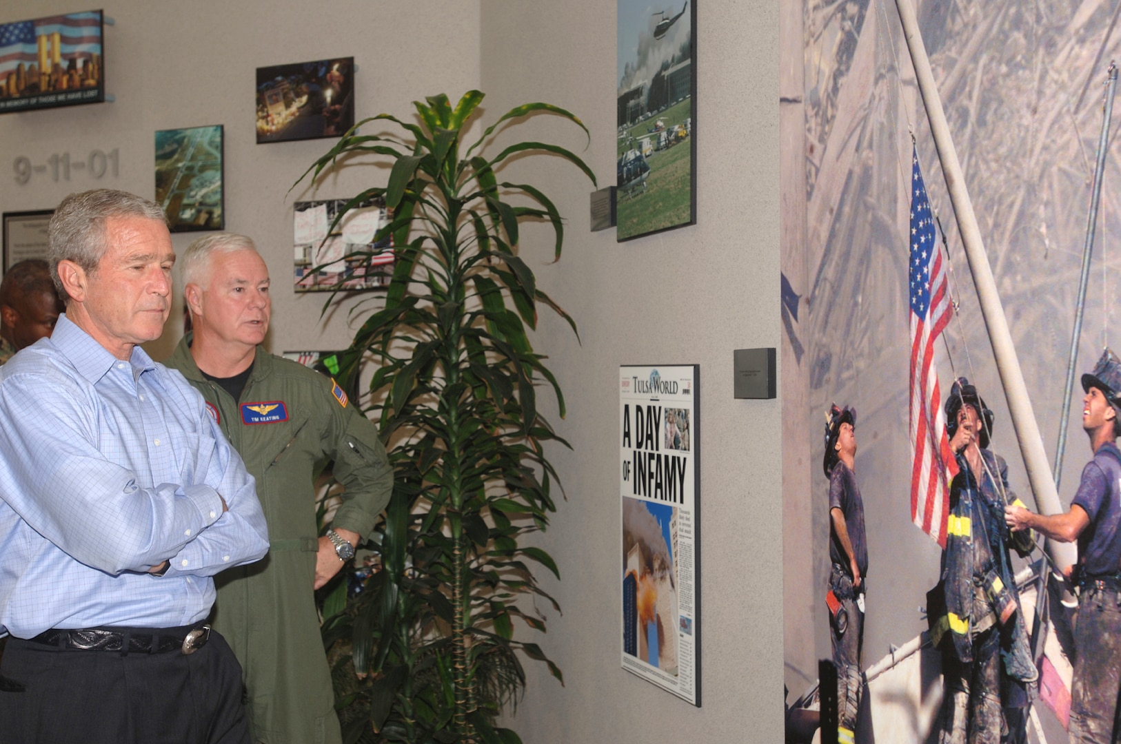 President George W. Bush and Adm. Timothy J. Keating, commander of U.S. Northern Command, take a moment to reflect at USNORTHCOM’s “9-11 Wall.” The president and Secretary of Homeland Security Michael Chertoff were at USNORTHCOM Sept. 23-24 to monitor Hurricane Rita from the USNORTHCOM Joint Operations Center.