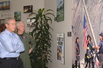 President George W. Bush and Adm. Timothy J. Keating, commander of U.S. Northern Command, take a moment to reflect at USNORTHCOM’s “9-11 Wall.” The president and Secretary of Homeland Security Michael Chertoff were at USNORTHCOM Sept. 23-24 to monitor Hurricane Rita from the USNORTHCOM Joint Operations Center.